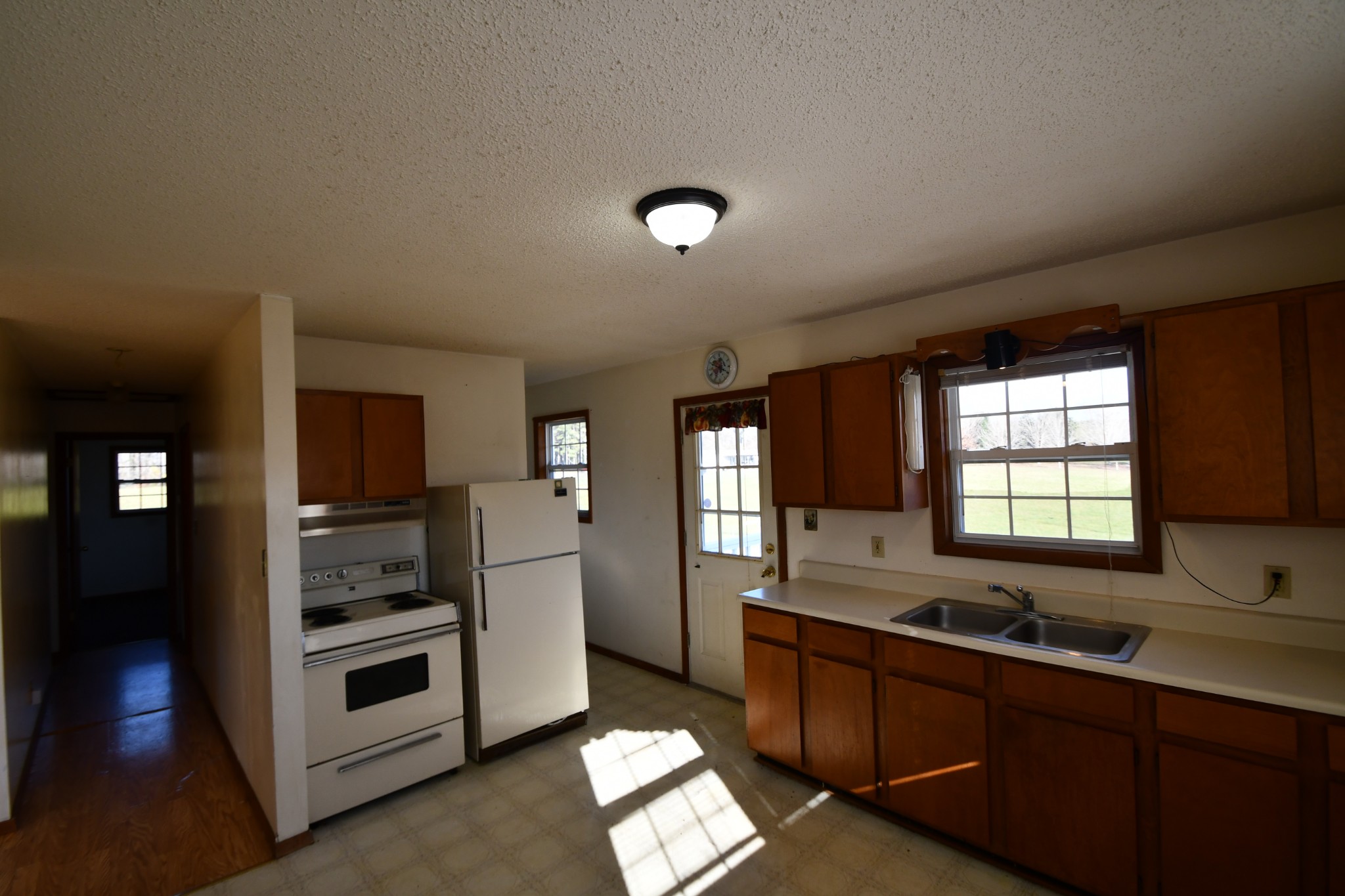 7 Fleeman Road Lawrenceburg, TN 38464 - Photo 10 of 16 a kitchen with stainless steel appliances a sink stove and refrigerator
