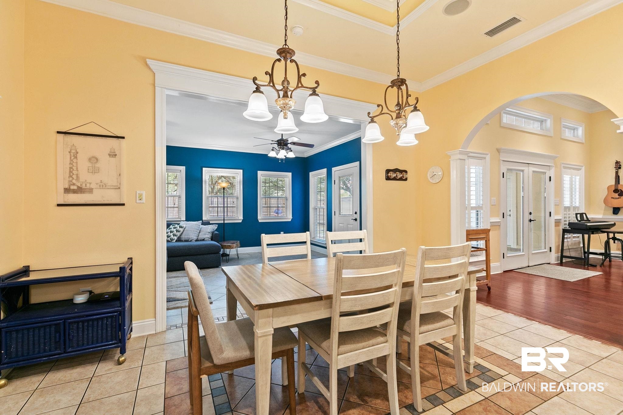3668 Claridge Road North Mobile, AL 36608 - Photo 44 of 100 Dining area with arched walkways, light tile patterned floors, a ceiling fan, crown molding, and suspended lighting
