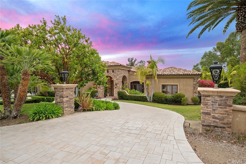 16946 Circa Del Sur Rancho Santa Fe, CA 92067 - Photo 1 of 1 a front view of a house with a yard and garage