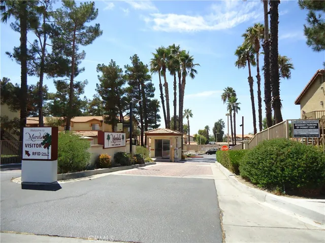 a row of palm trees and a fire pit