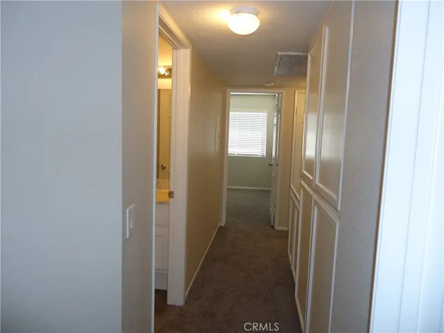 a view of a livingroom from a hallway