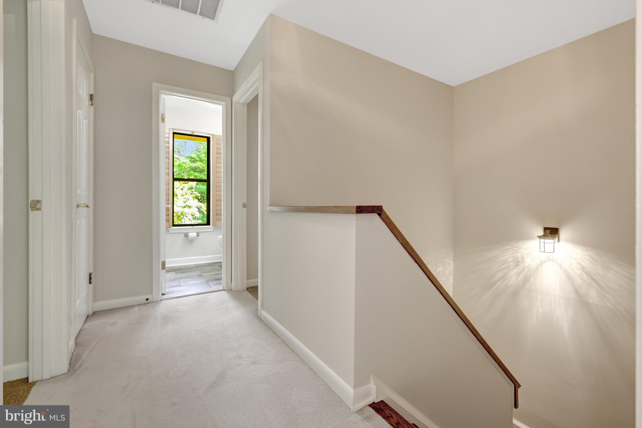 11088 Glade Court Reston, VA 20191 - Photo 23 of 75 a view of hallway with furniture and a window