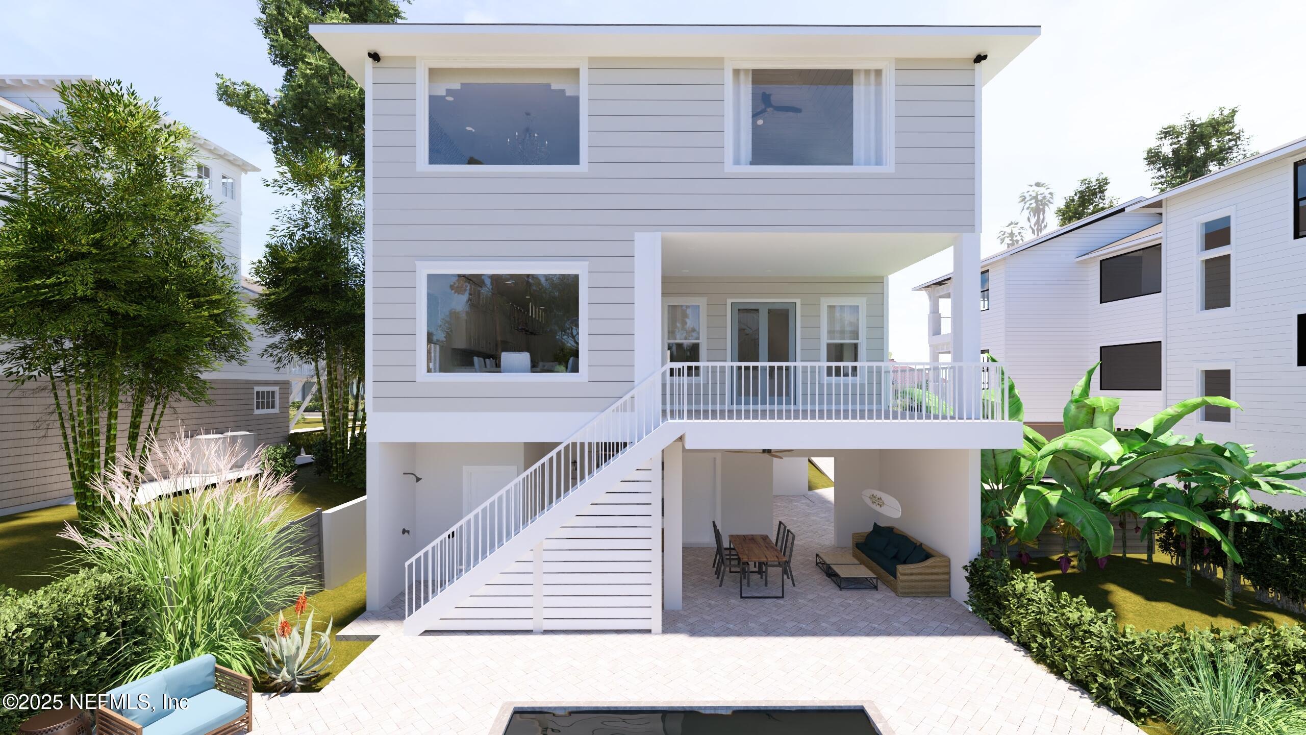 2016 Beach Avenue Atlantic Beach, FL 32233 - Photo 2 of 18 a front view of a house with large windows and potted plants