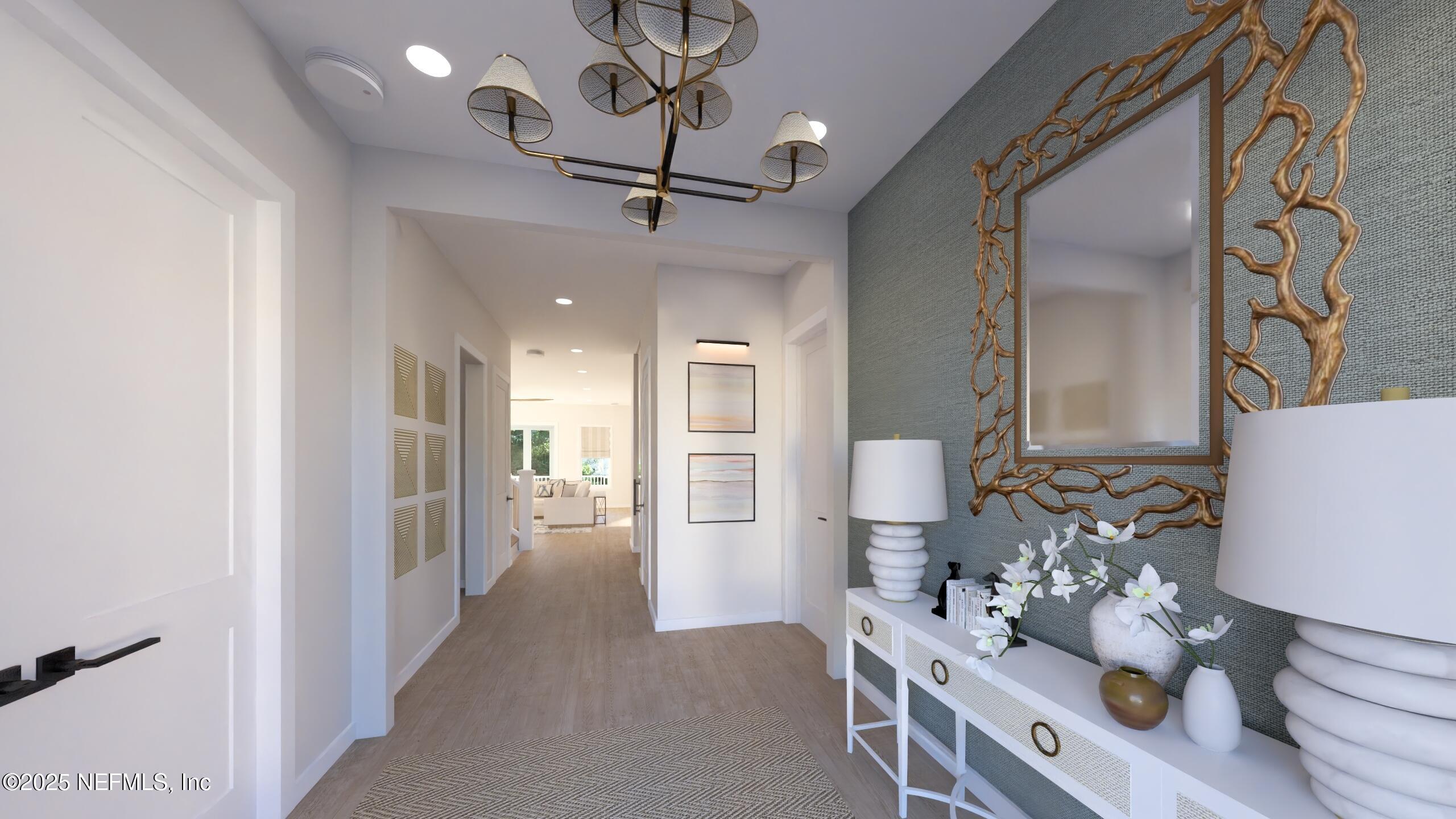 2016 Beach Avenue Atlantic Beach, FL 32233 - Photo 3 of 18 a view of a hallway with furniture and wooden floor