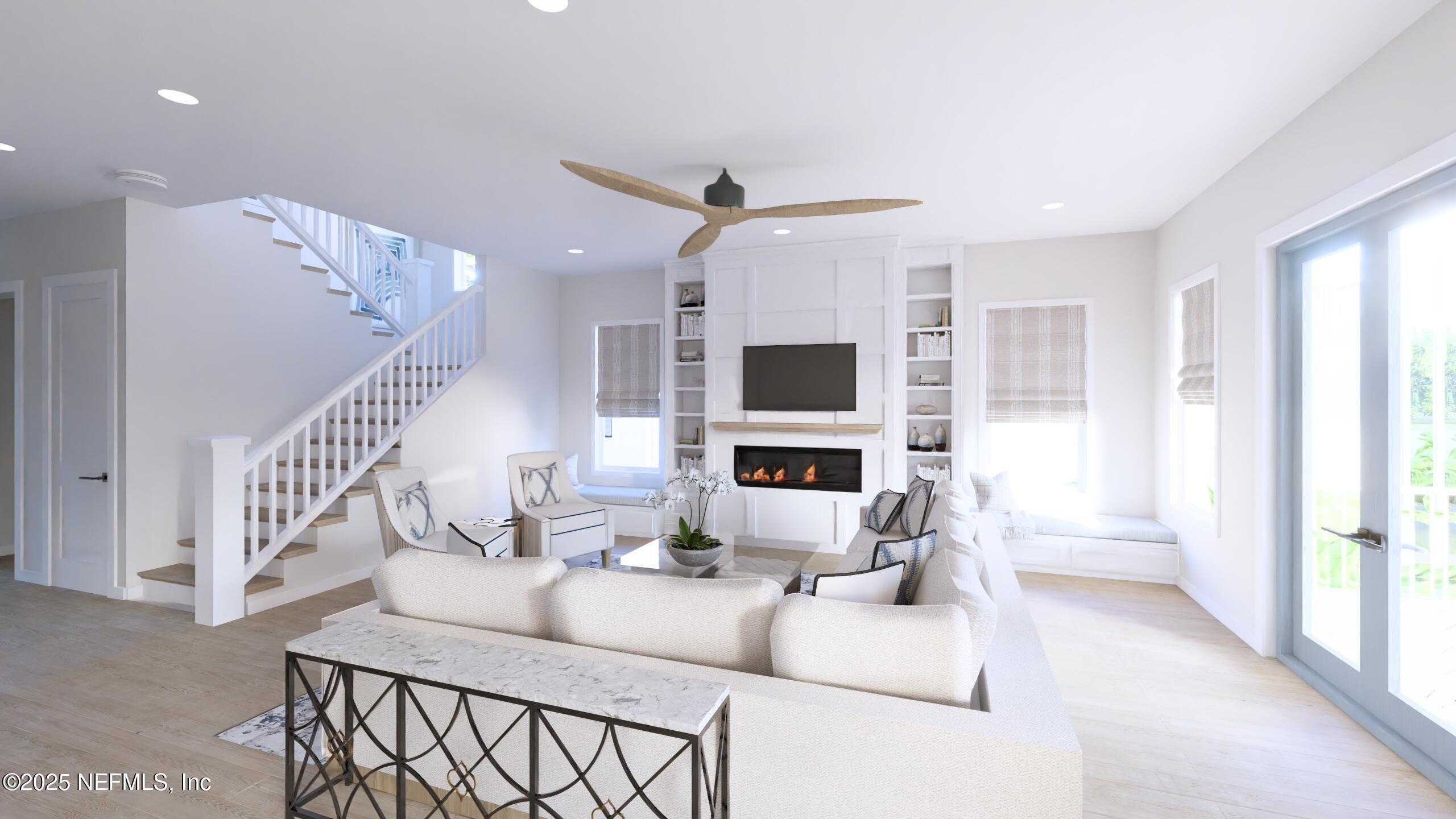 2016 Beach Avenue Atlantic Beach, FL 32233 - Photo 5 of 18 a living room with furniture a flat screen tv and a chandelier