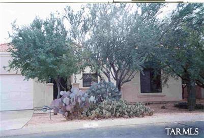 1 East Desert Sky Road, Unit 15 Tucson, AZ 85737 - Photo 1 of 6 a front view of a house with a tree