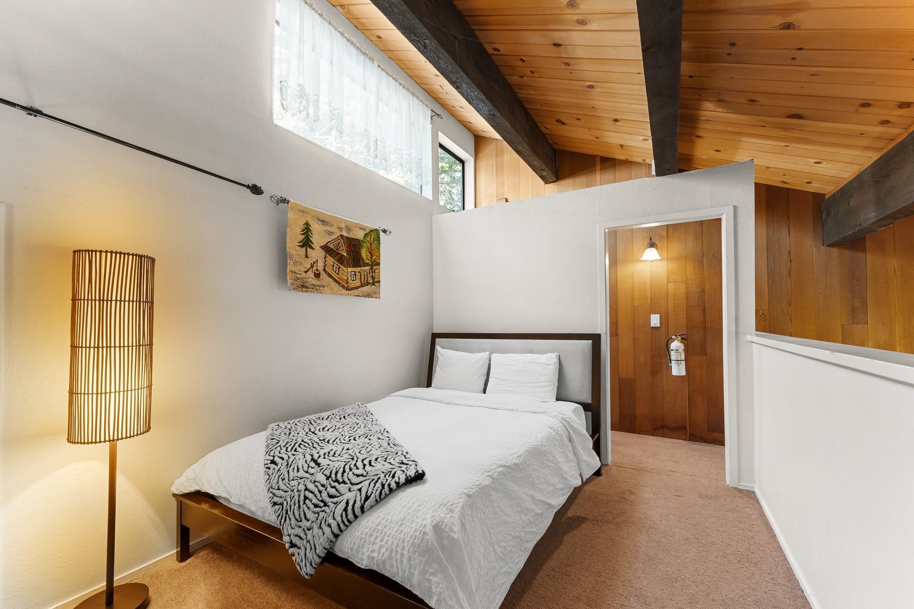 1001 Commonwealth Drive, Unit 101 Kings Beach, CA 96143 - Photo 13 of 28 a bedroom with a bed and a window