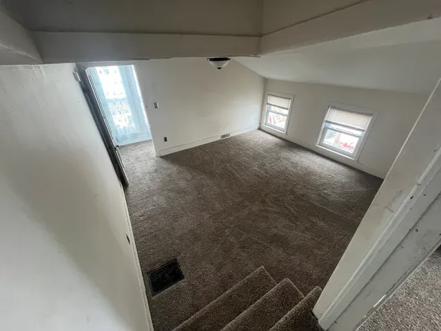 a front view of house with yard outdoor seating and barbeque oven