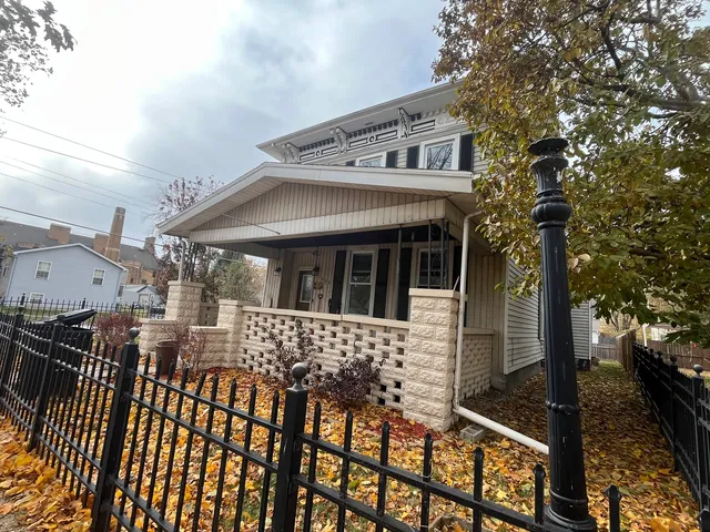 a view of a house with large windows