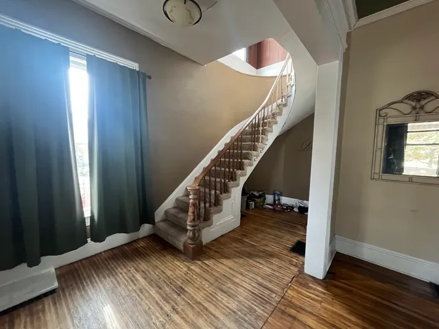 a view of entryway with wooden floor