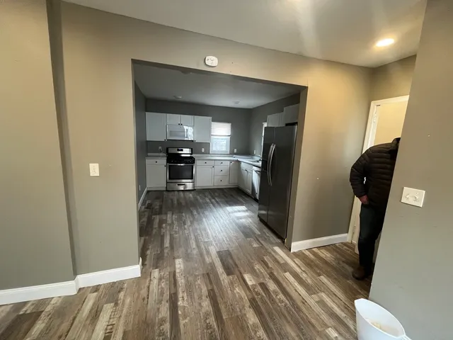 a view of a kitchen from the hallway