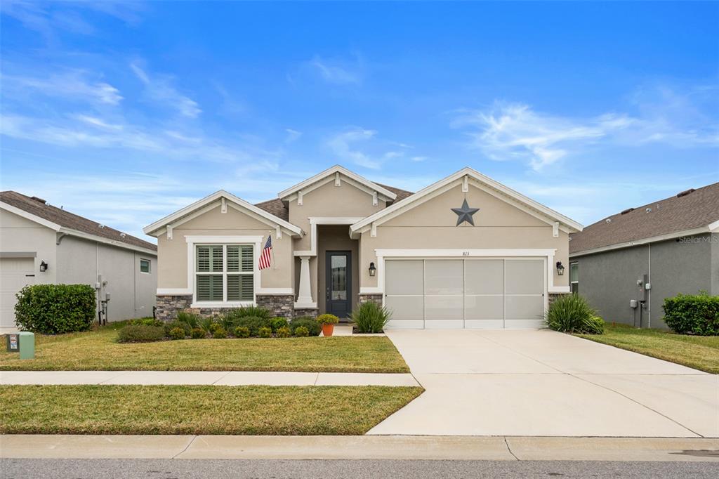 813 Old Windsor Way Spring Hill, FL 34609 - Photo 1 of 1 a front view of a house with a yard