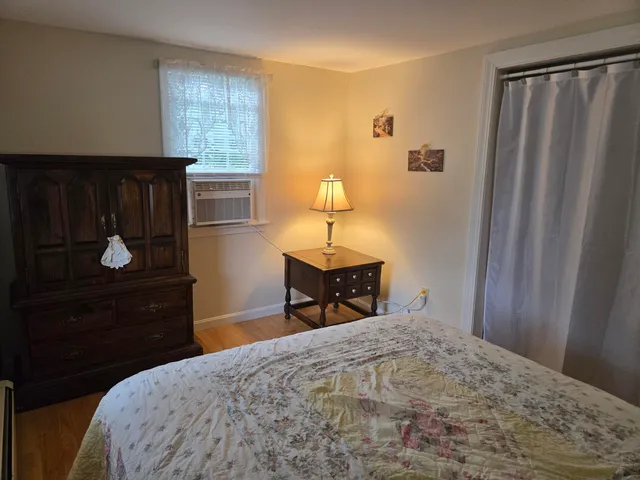 a bedroom with a bed and a closet