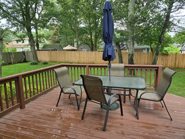 a view of chair and table on the wooden floor