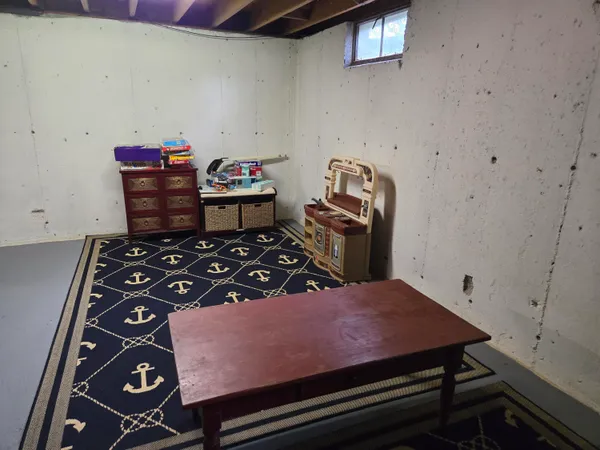 a bedroom with a bed and dresser