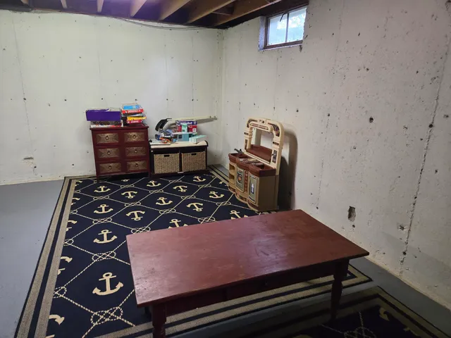 a bedroom with a bed and dresser