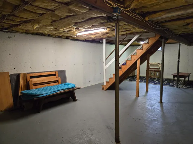 a room with stairs and a table