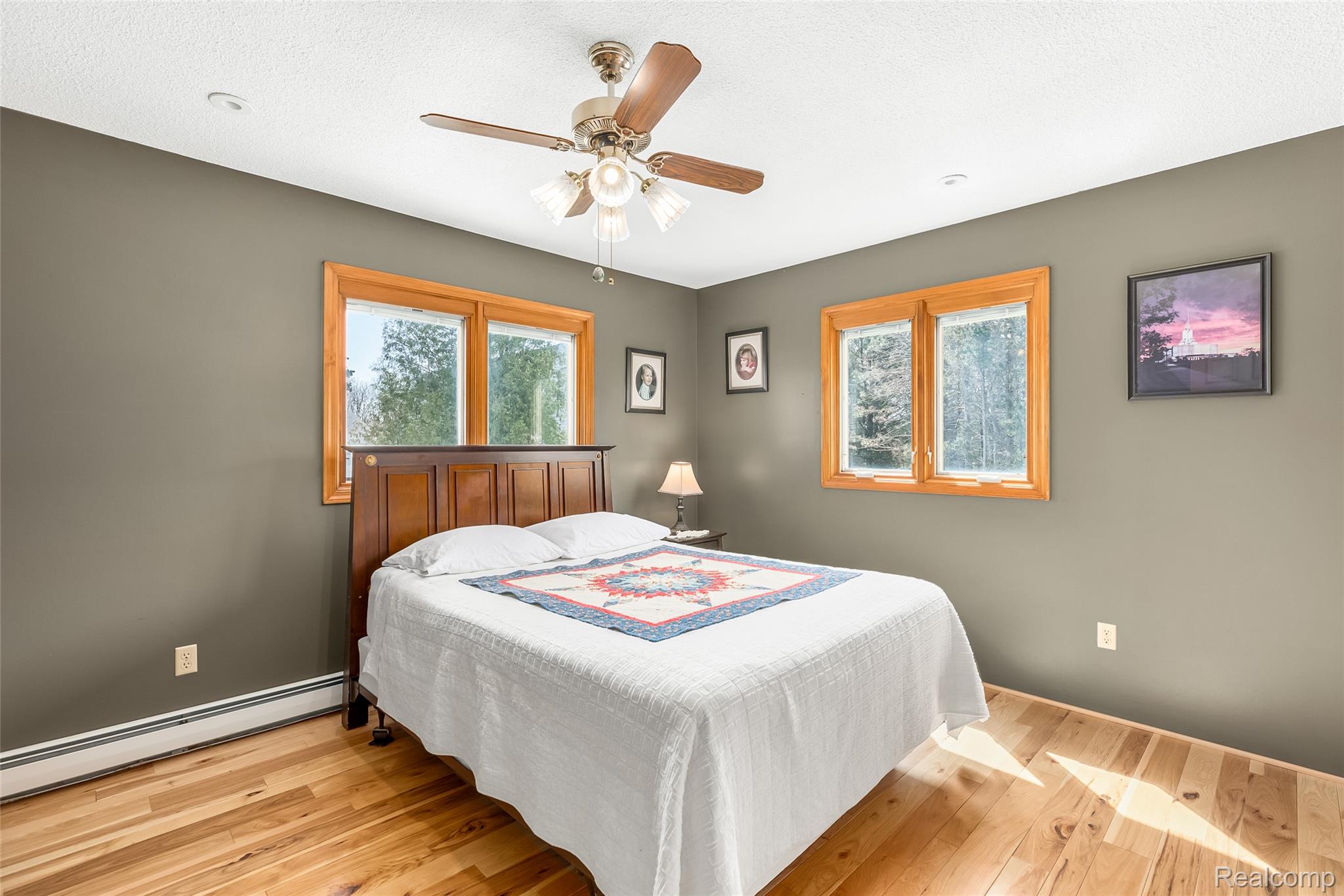 15395 Osius Road Chelsea, MI 48118 - Photo 16 of 55 Bedroom featuring wood-finish flooring and neutral wall tones