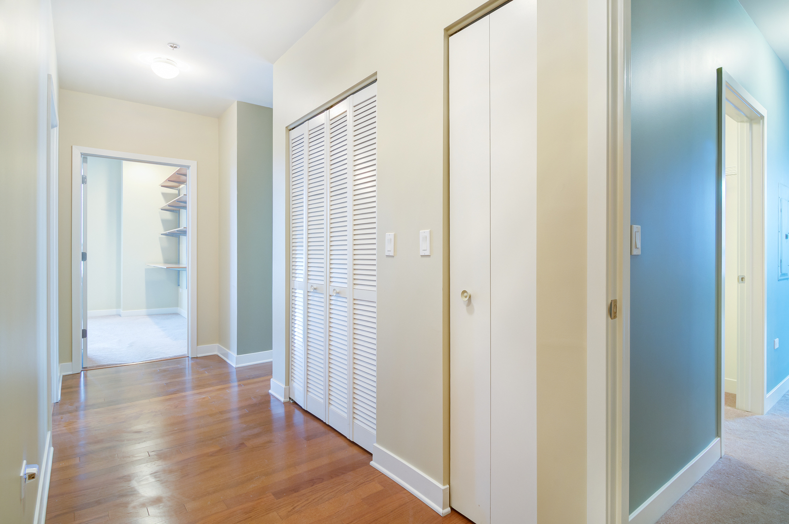 6000 North Cicero Avenue, Unit 511 Chicago, IL 60646 - Photo 16 of 19 a view of a hallway with wooden floor