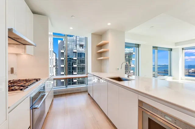 a kitchen with stainless steel appliances a stove and a refrigerator