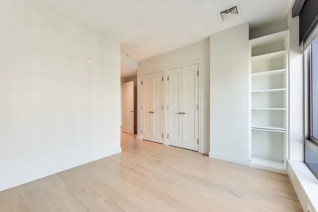 a bathroom with a glass shower door