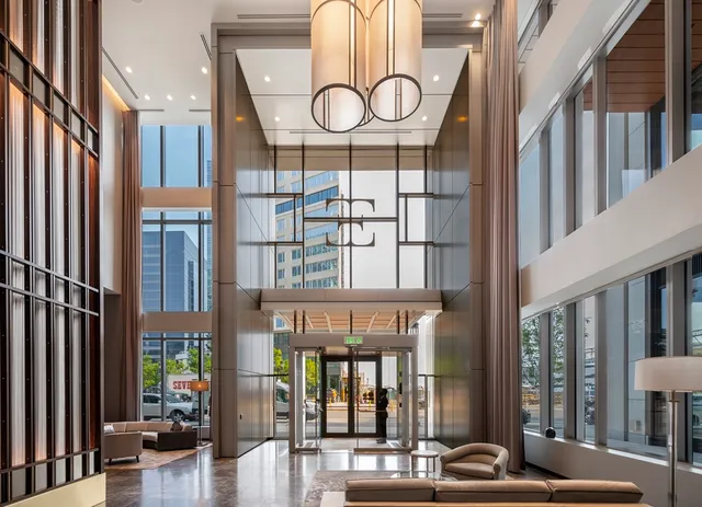 a building outdoor space with patio furniture and potted plants