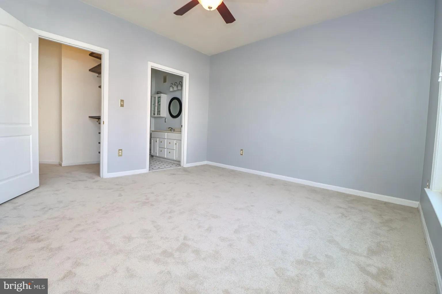 12185 Abington Hall Place, Unit 201 Reston, VA 20190 - Photo 11 of 32 an empty room with chandelier fan
