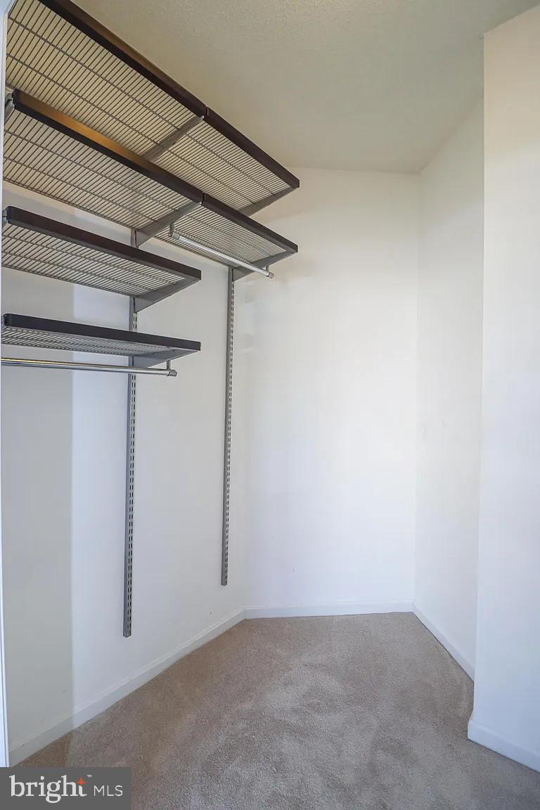 12185 Abington Hall Place, Unit 201 Reston, VA 20190 - Photo 15 of 32 a view of a room with racks on the wall