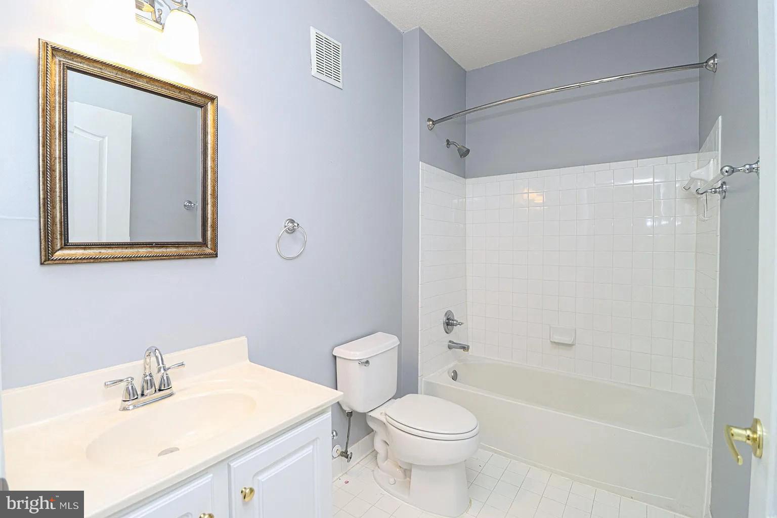 12185 Abington Hall Place, Unit 201 Reston, VA 20190 - Photo 18 of 32 a bathroom with a sink toilet and shower