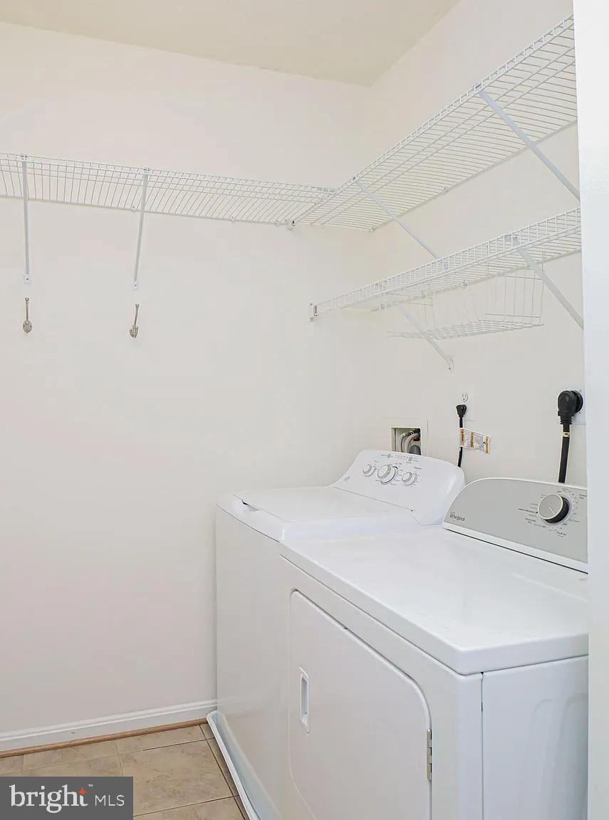 12185 Abington Hall Place, Unit 201 Reston, VA 20190 - Photo 20 of 32 a utility room with dryer and washer