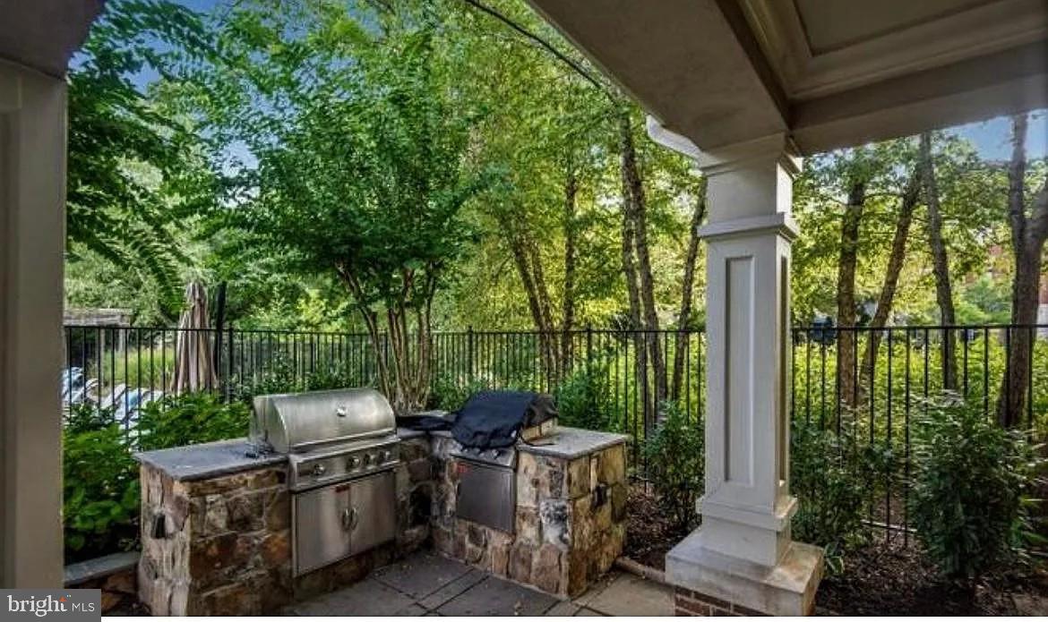 12185 Abington Hall Place, Unit 201 Reston, VA 20190 - Photo 25 of 32 a view of a patio in backyard