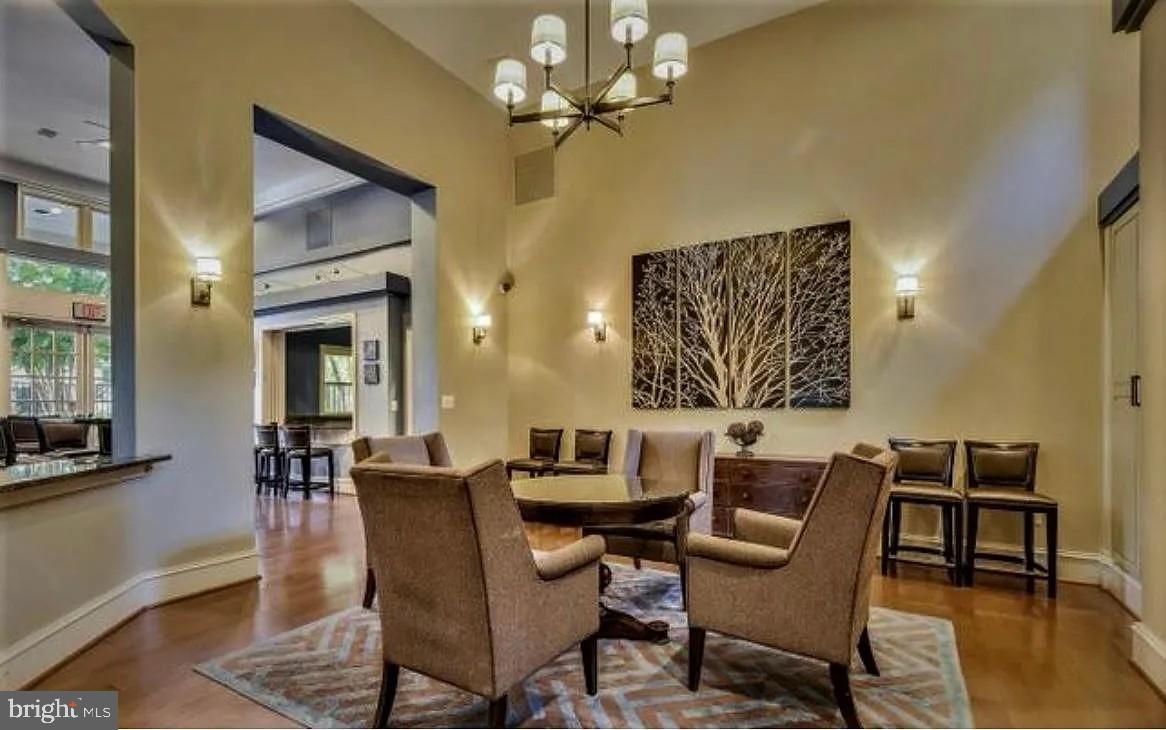 12185 Abington Hall Place, Unit 201 Reston, VA 20190 - Photo 29 of 32 a dining room with furniture and window