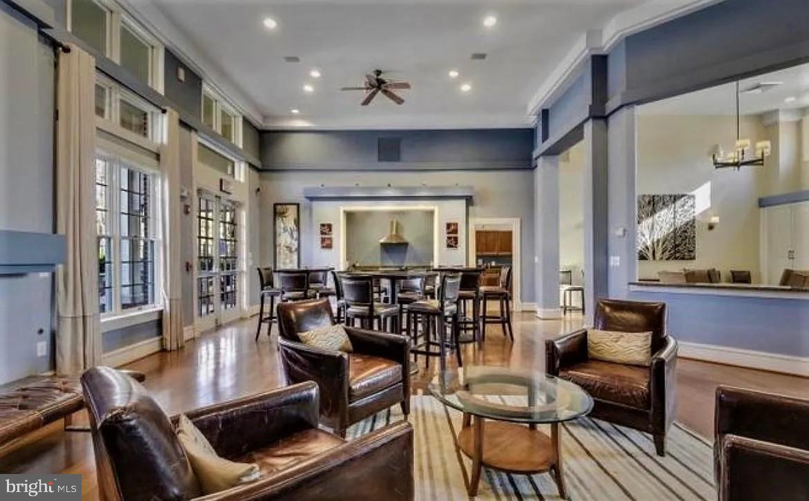 12185 Abington Hall Place, Unit 201 Reston, VA 20190 - Photo 30 of 32 a view of a dining room with furniture window and wooden floor