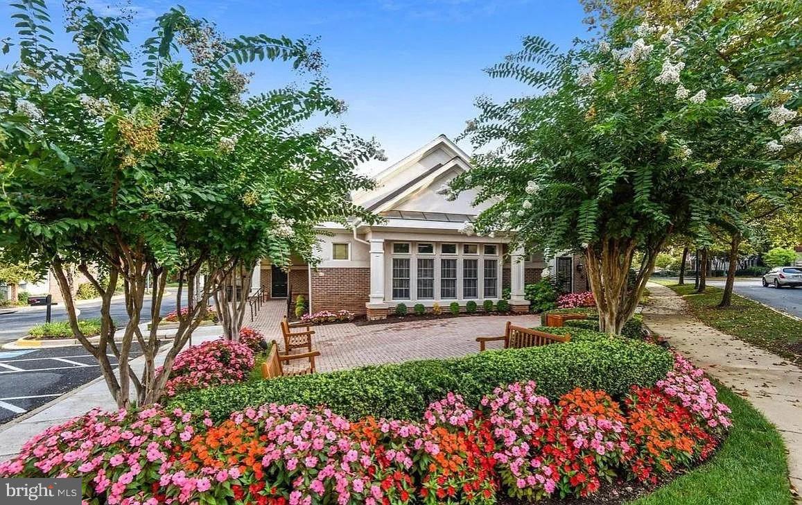 12185 Abington Hall Place, Unit 201 Reston, VA 20190 - Photo 31 of 32 front view of a house with a yard