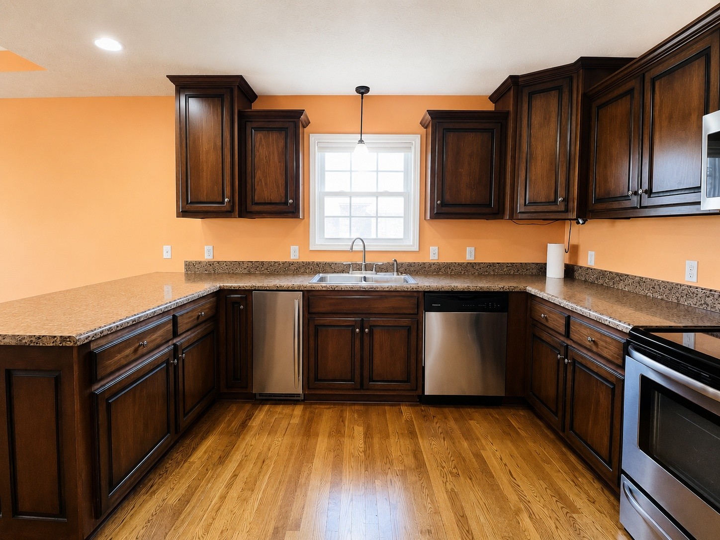 663 Jackson Road Portland, TN 37148 - Photo 12 of 32 a kitchen with granite countertop stainless steel appliances and wooden cabinets