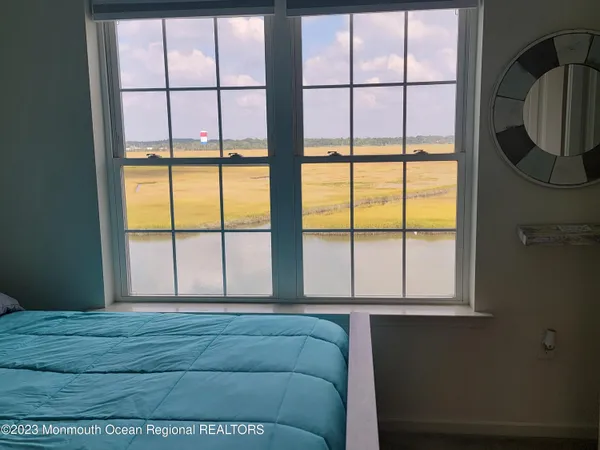 a room with a bed and a window