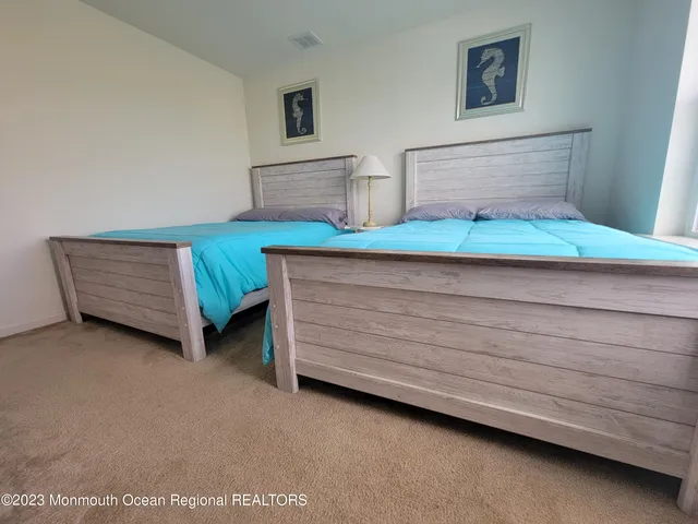 a view of room with furniture and cabinet