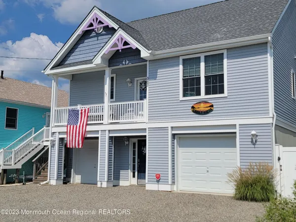 a front view of a house with a garage