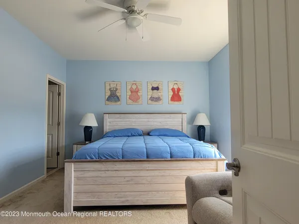 a bedroom with a bed and furniture