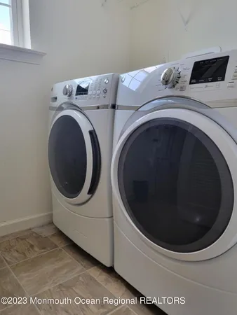 a utility room with dryer and washer
