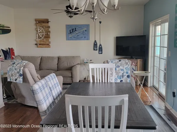 a kitchen with stainless steel appliances granite countertop a stove a microwave and wooden cabinets