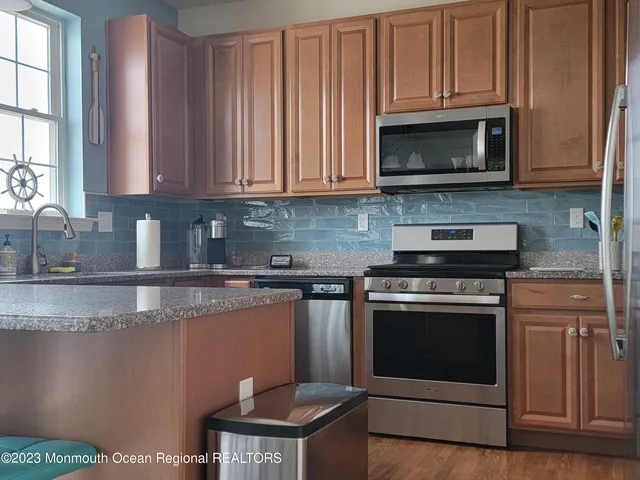 a view of hall way with furniture