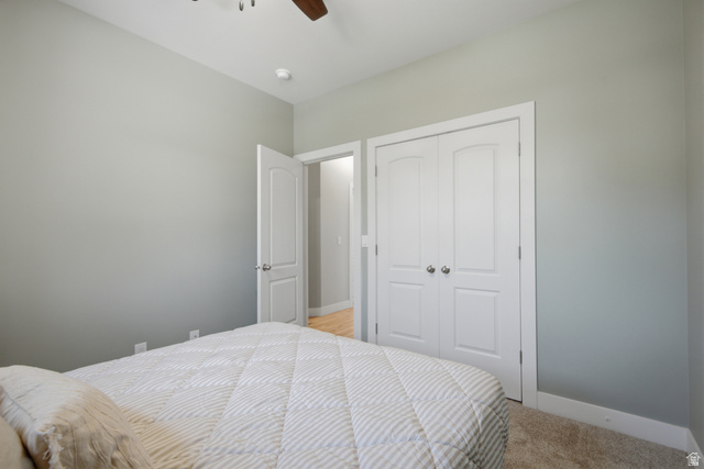 1252 Skyline Road Saratoga Springs, UT 84045 - Photo 26 of 51 Bedroom featuring light gray walls, white trim, and a ceiling fan