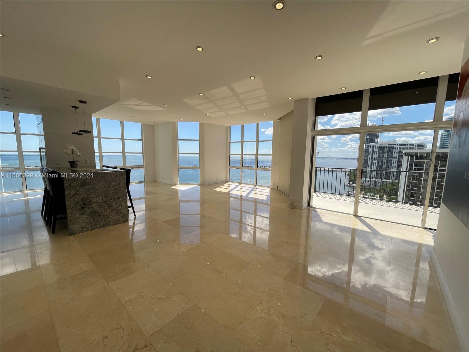 1865 Brickell Avenue, Unit APH6 Miami, FL 33129 - Photo 1 of 24 a lobby with furniture and floor to ceiling window