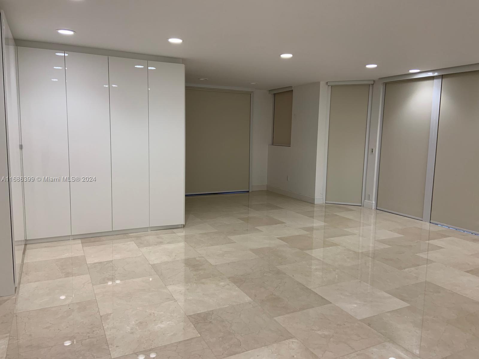 1865 Brickell Avenue, Unit APH6 Miami, FL 33129 - Photo 17 of 24 a view of an empty room