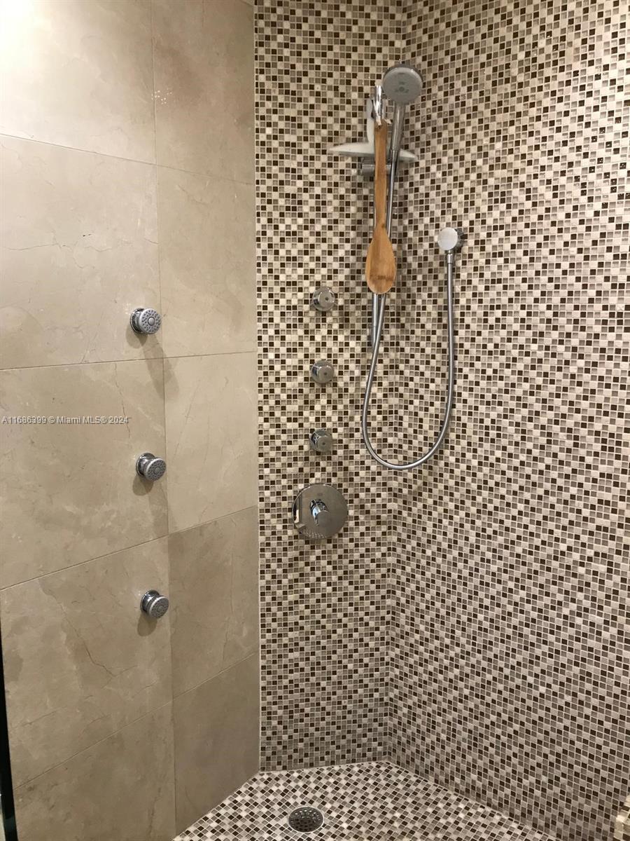 1865 Brickell Avenue, Unit APH6 Miami, FL 33129 - Photo 20 of 24 a bathroom with a shower