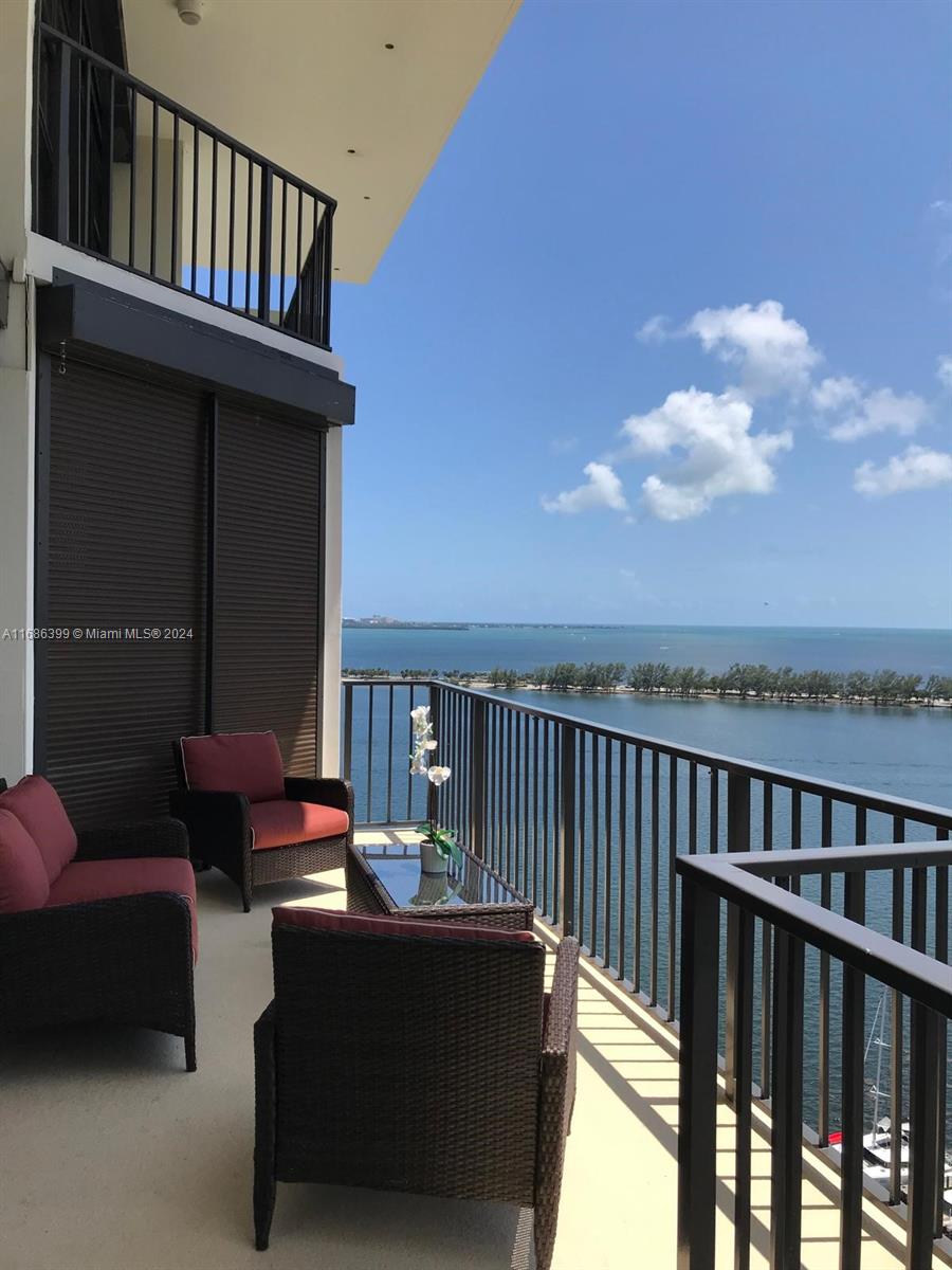 1865 Brickell Avenue, Unit APH6 Miami, FL 33129 - Photo 23 of 24 a view of a balcony with furniture