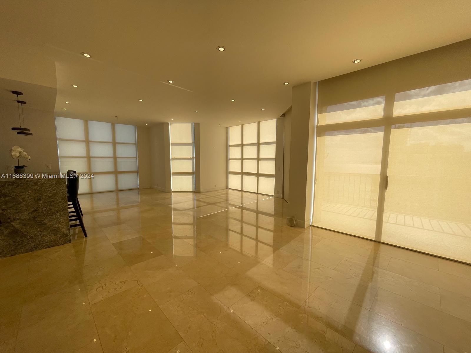 1865 Brickell Avenue, Unit APH6 Miami, FL 33129 - Photo 7 of 24 a view of a hallway