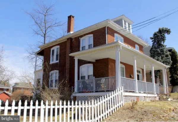 a front view of a house with a porch