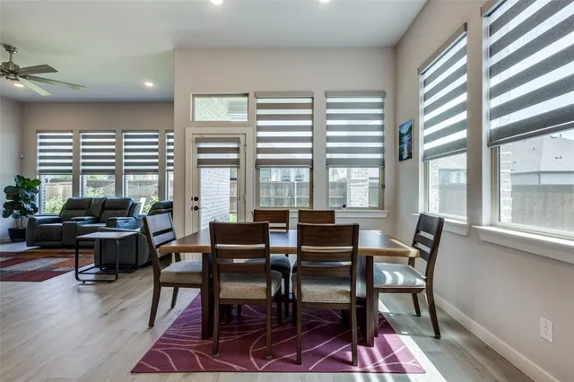 a view of a dining room with furniture window and outside view